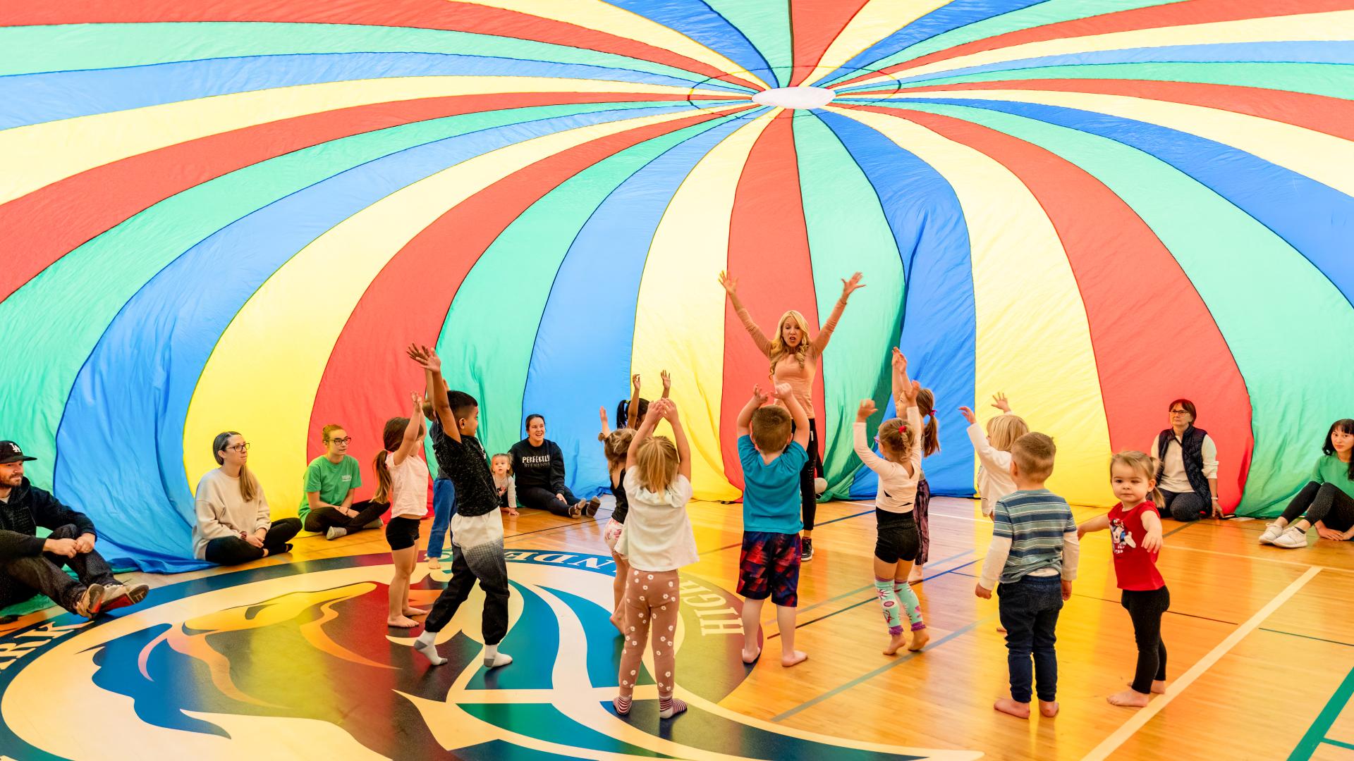 Kids Playing in a Parachute