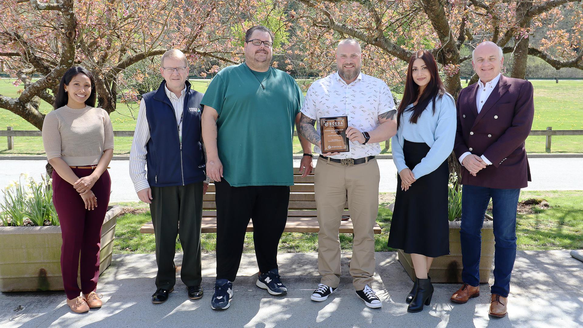 Members of the LMS Society and the City of Mission accept an award