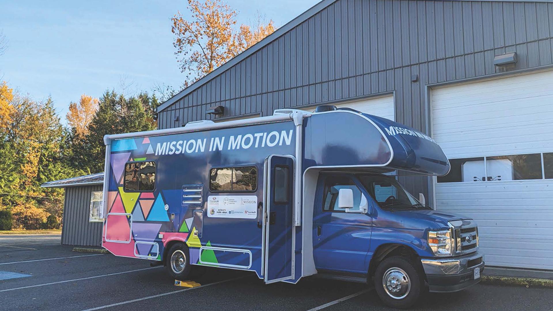 Mission in motion medical youth rv camper parked in front of youth centre