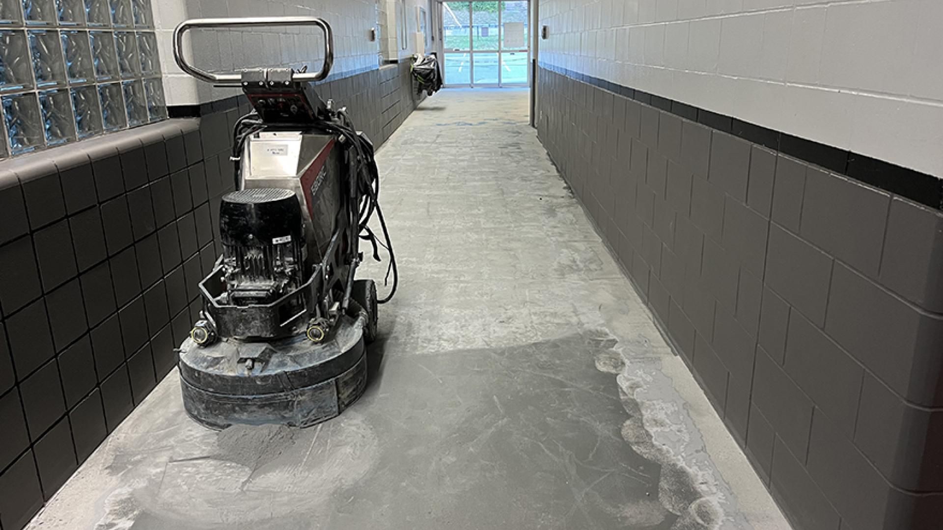 Arena entrance hallway concrete grinding and polish