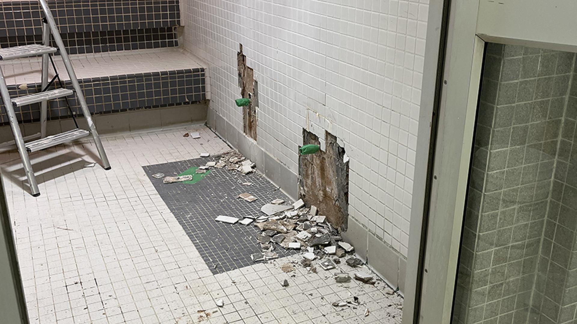 Demolished steam room tiles and floor