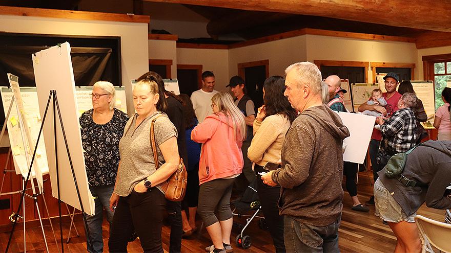 Residents looking at information at an Official Community Plan Open House