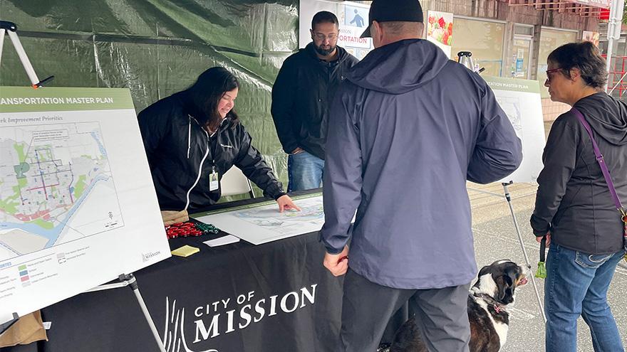 Staff at a recent event talking about transportation in Mission