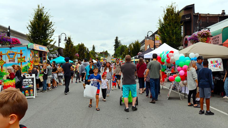 down town mission closed to cars and filled with family & community members at activity booths