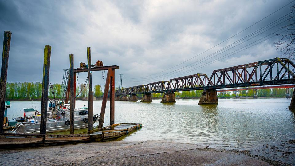 Mission river crossing train bridge on cloudy day from harbour mission side