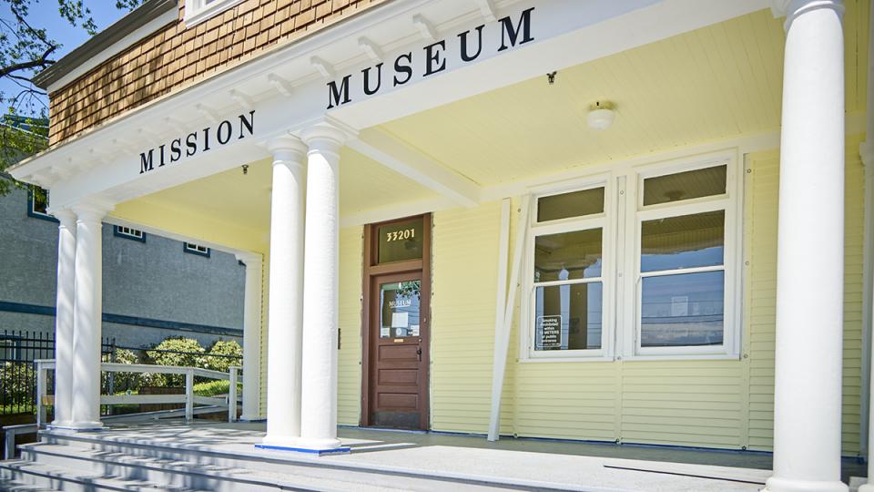 yellow front building exterior and entrance of newly renovated mission museum